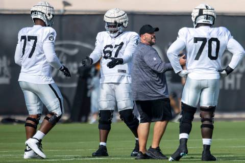 Raiders offensive linemen Thayer Munford (77), Lester Cotton, Sr. (67) and Alex Leatherwood (70 ...