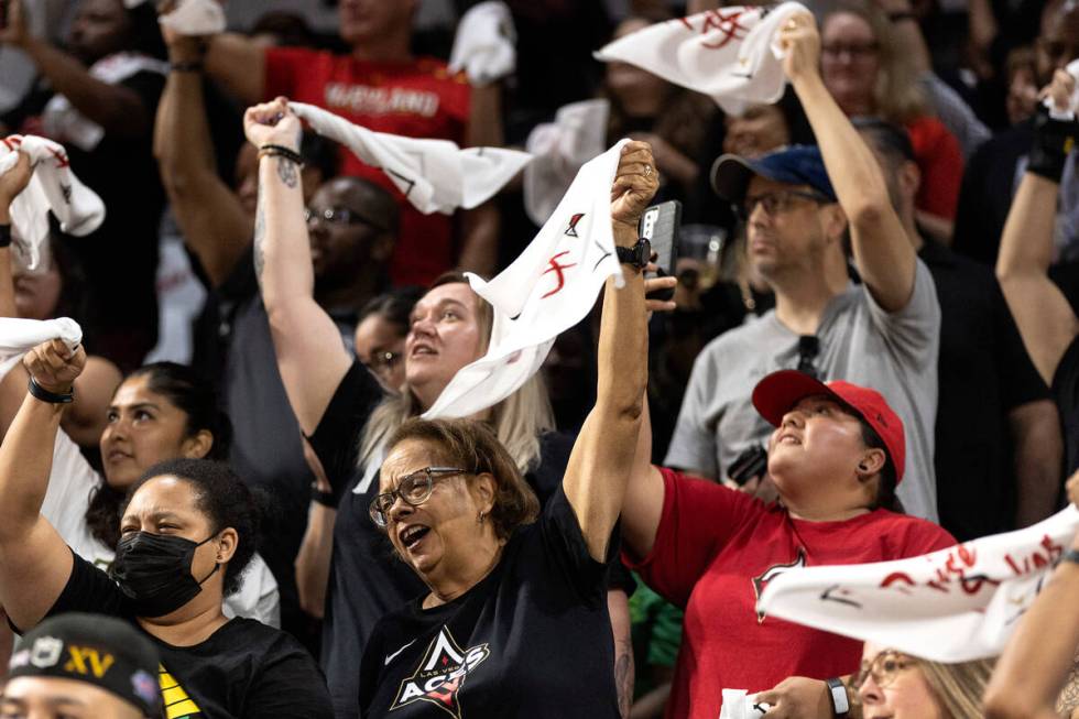 Las Vegas Aces fans cheer for their team during the first half of a WNBA basketball game agains ...