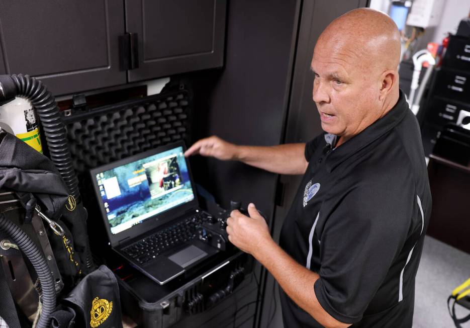 Technical diver Steve Schafer shows how he uses an underwater remote-operated vehicle at his He ...