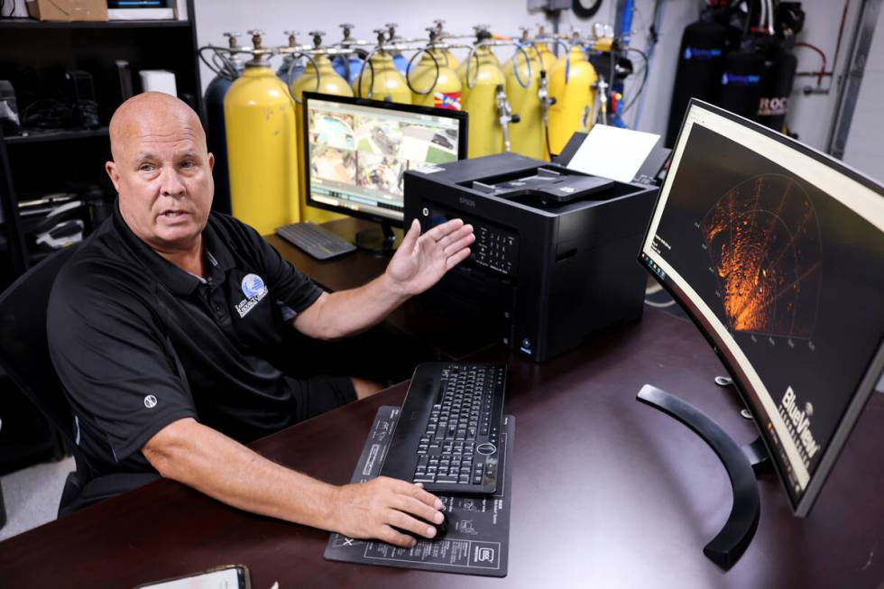 Technical diver Steve Schafer shows an image from a deep-water sonar at his Henderson home Wedn ...