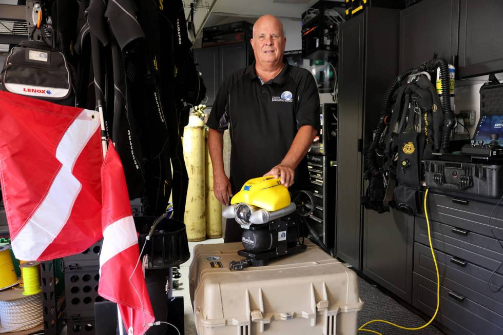 Technical diver Steve Schafer shows an underwater remote-operated vehicle at his Henderson home ...