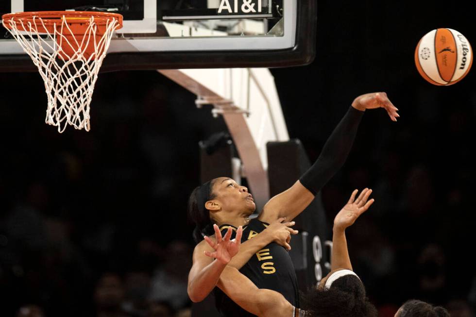 Las Vegas Aces forward A'ja Wilson (22) knocks an attempted shot away from Phoenix Mercury forw ...