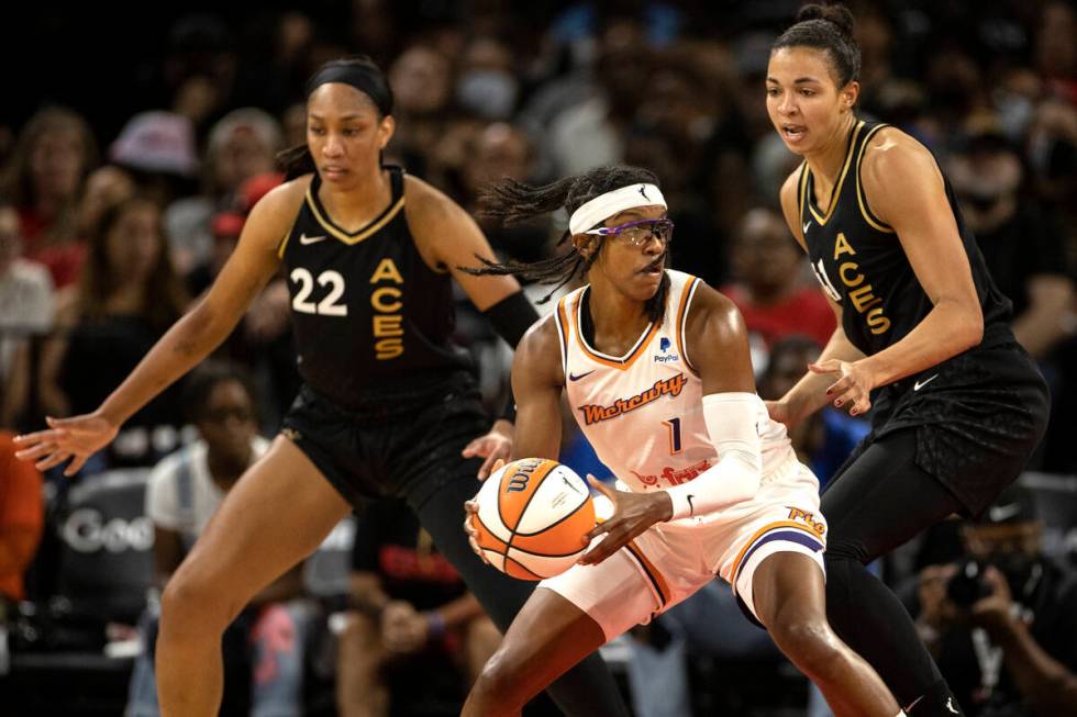 Phoenix Mercury guard Diamond DeShields (1) dribbles around Las Vegas Aces forward A'ja Wilson ...