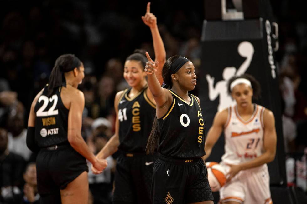 Las Vegas Aces guard Jackie Young (0), center Kiah Stokes (41) and forward A'ja Wilson (22) cel ...