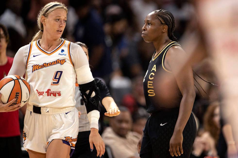 Las Vegas Aces guard Chelsea Gray (12) reacts after Phoenix Mercury guard Sophie Cunningham (9) ...