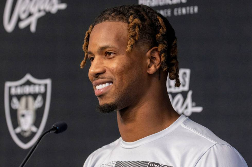 Raiders wide receiver Tyron Johnson reacts to a question during a news conference at the Interm ...