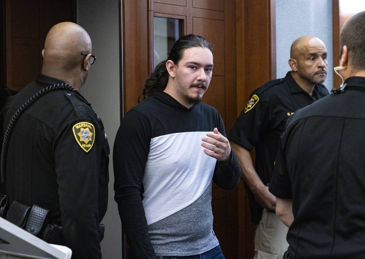 Maysen Melton, center, enters the courtroom for his sentencing hearing at the Regional Justice ...