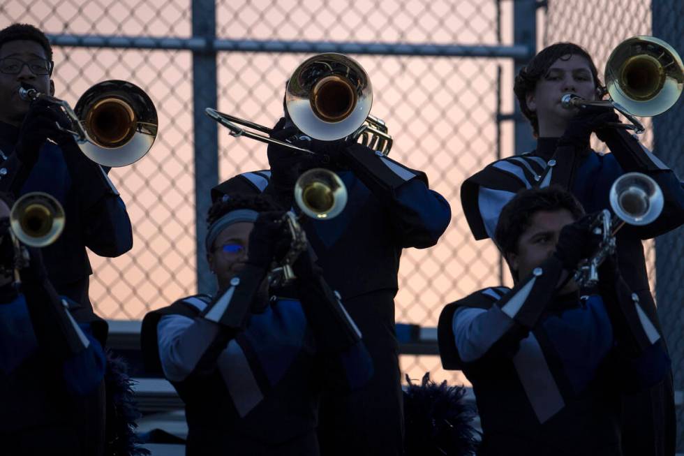 The Shadow Ridge horn section of the marching band plays during a Class 4A high school football ...