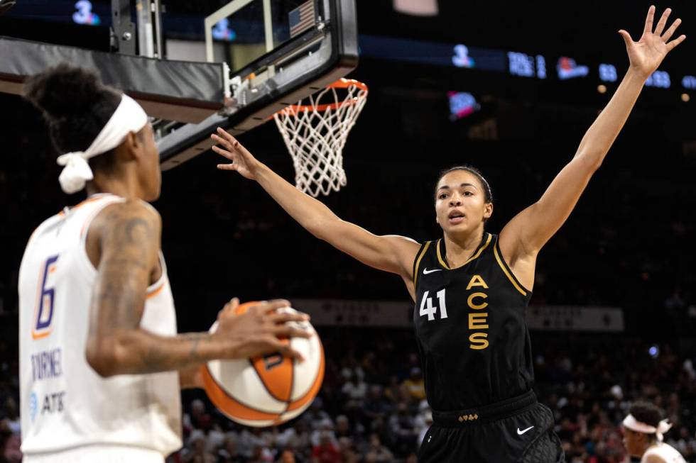 Las Vegas Aces center Kiah Stokes (41) surrounds Phoenix Mercury guard Yvonne Turner during the ...