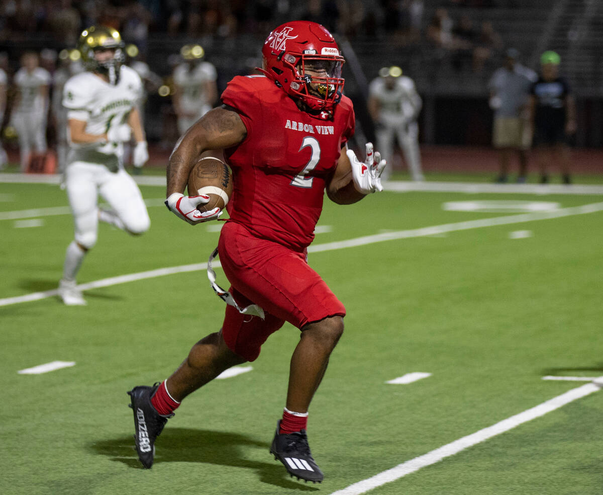 Arbor View High School's Juice Washington (2) makes a run down the field in the first game of t ...