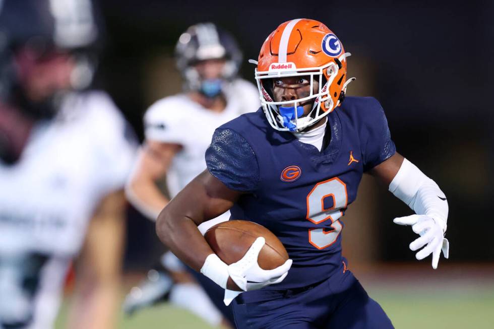 Bishop Gorman's Elija Lofton (9) runs the ball against Corner Canyon during the first half of a ...