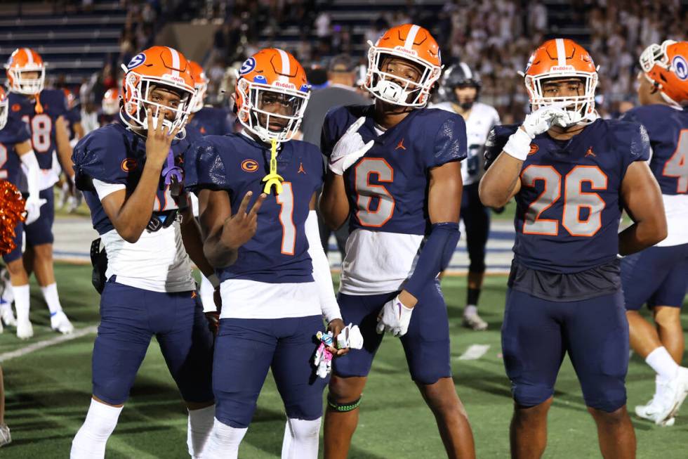 Bishop Gorman players pose following their win over Corner Canyon 42-7 during a football game a ...