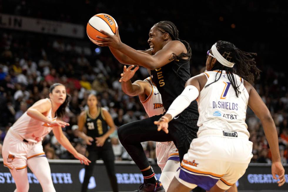 Las Vegas Aces guard Chelsea Gray (12) shoots against Phoenix Mercury guard Diamond DeShields ( ...