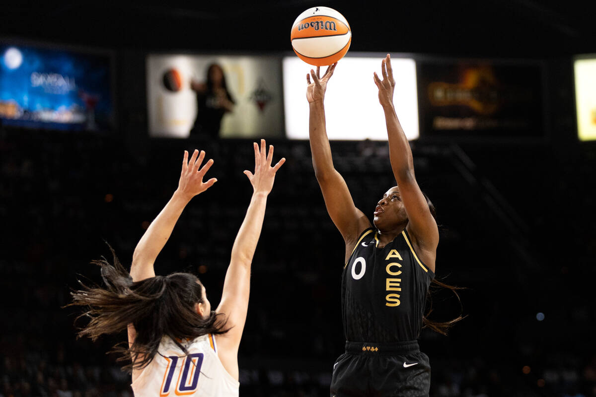 Las Vegas Aces guard Kelsey Plum (10) shoots against Phoenix Mercury center Megan Gustafson (10 ...