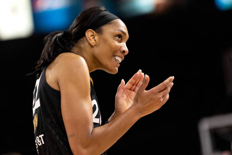 Las Vegas Aces forward A'ja Wilson (22) claps to the crowd after a referee called a foul on the ...