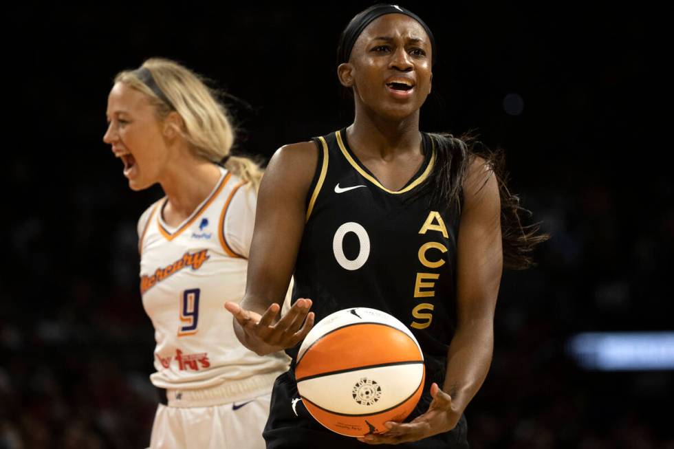 Las Vegas Aces guard Jackie Young (0) and Phoenix Mercury guard Sophie Cunningham (9) react aft ...