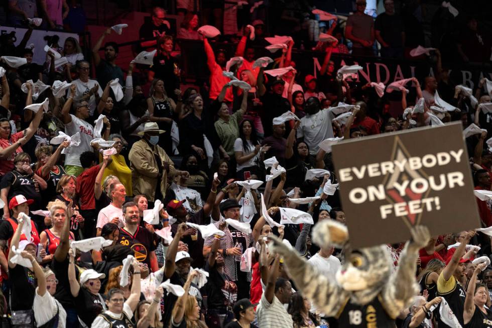 The Las Vegas Aces mascot asks the crowd to stand and cheer for their team during the second ha ...