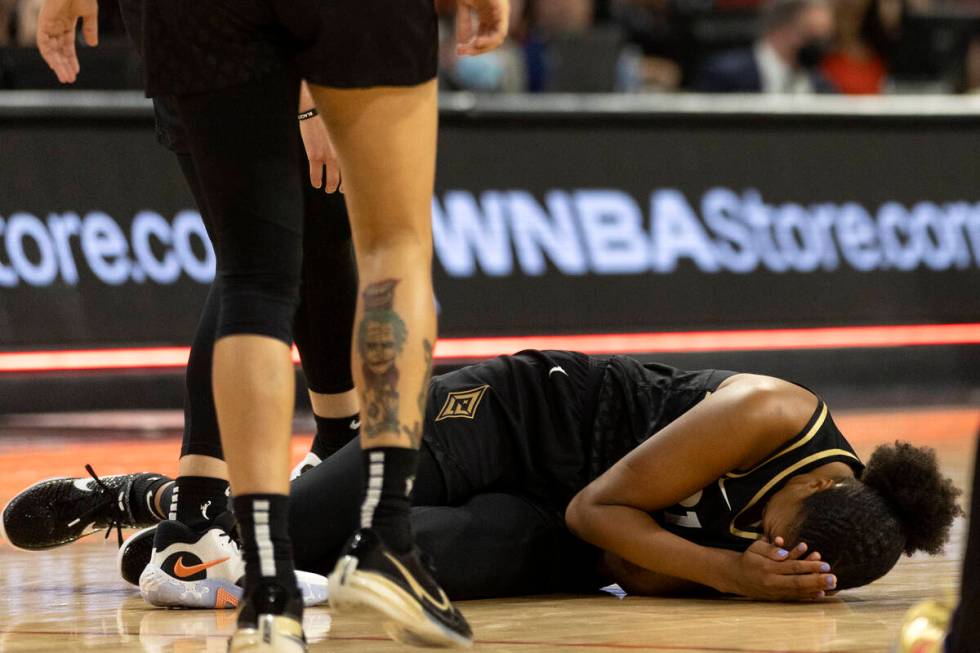 Las Vegas Aces center Iliana Rupert (21) falls to the floor in pain during the second half of a ...