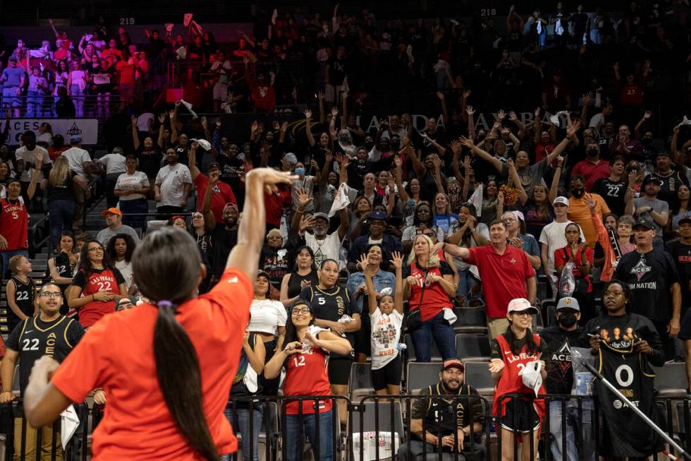 Las Vegas Aces guard Jackie Young throws a t-shirt into the crowd after winning a WNBA playoff ...