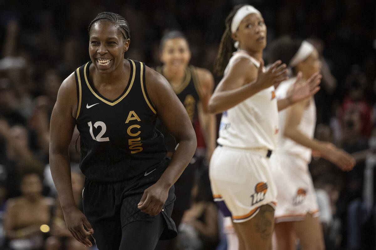 Las Vegas Aces guard Chelsea Gray (12) celebrates after scoring a 3-point shot against the Phoe ...