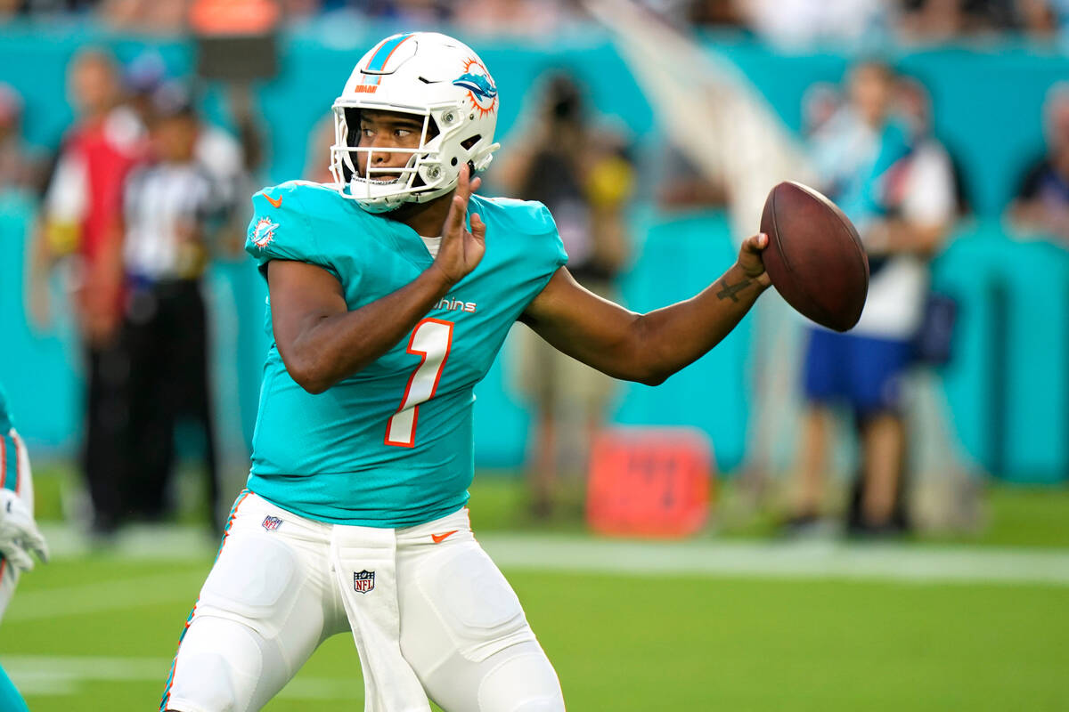 Miami Dolphins quarterback Tua Tagovailoa (1) aims a pass during the first half of a NFL presea ...
