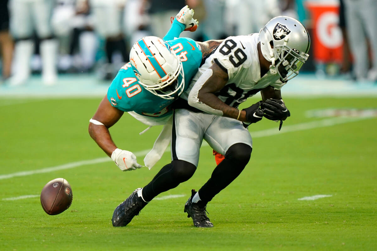 Miami Dolphins cornerback Nik Needham (40) breaks up a pass intended for Las Vegas Raiders wide ...