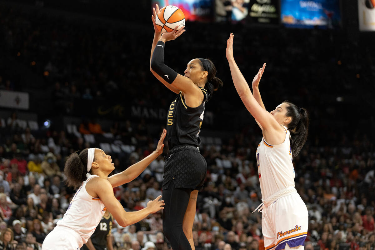 Las Vegas Aces forward A'ja Wilson (22) shoots against Phoenix Mercury forward Brianna Turner, ...