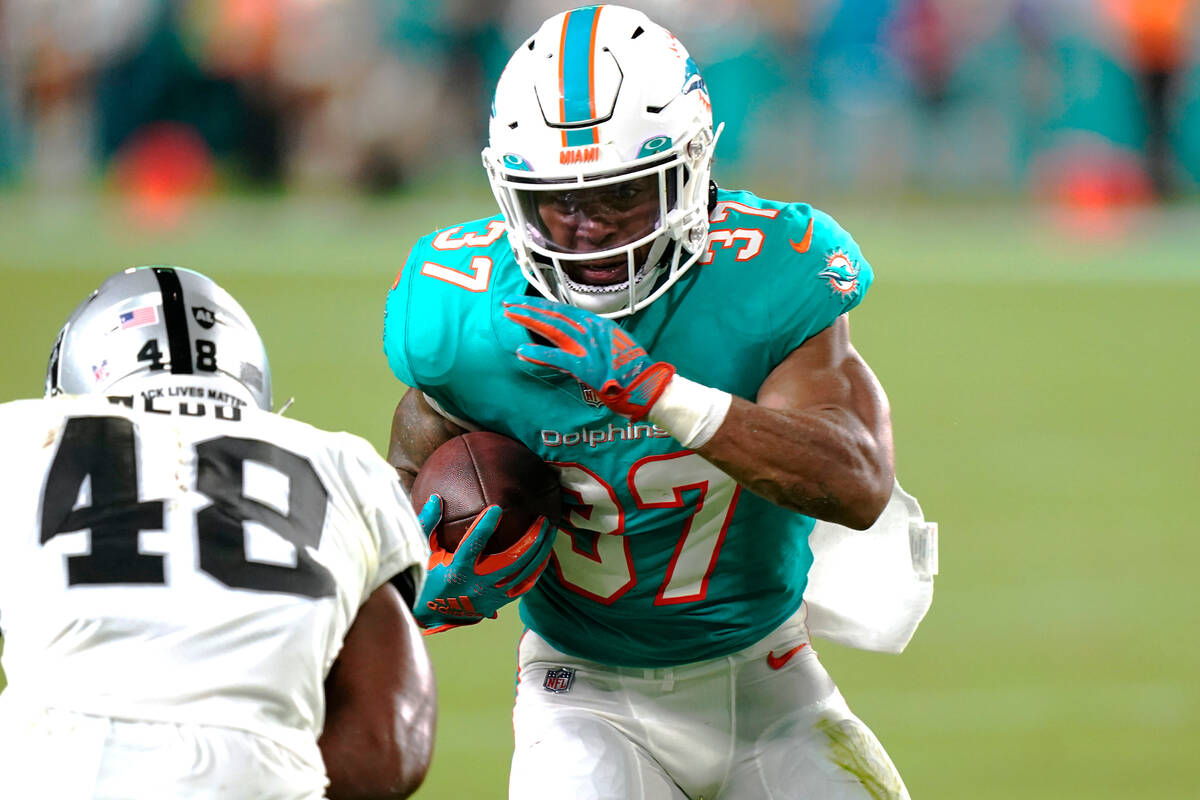 Miami Dolphins running back Myles Gaskin (37) runs with the ball during the first half of a NFL ...