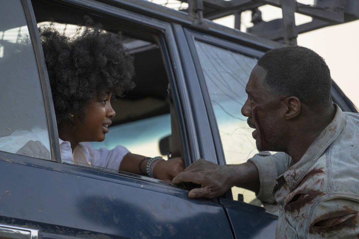 This image released by Universal Pictures shows Leah Jeffries, left, and Idris Elba in a scene ...
