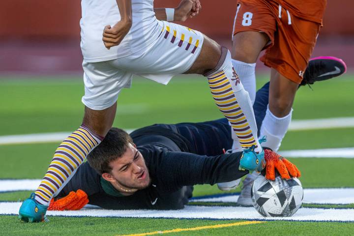 Legacy goalkeeper Angel Rodriguez-Torres (2) grabs the ball after a scoring attempt by Eldorado ...