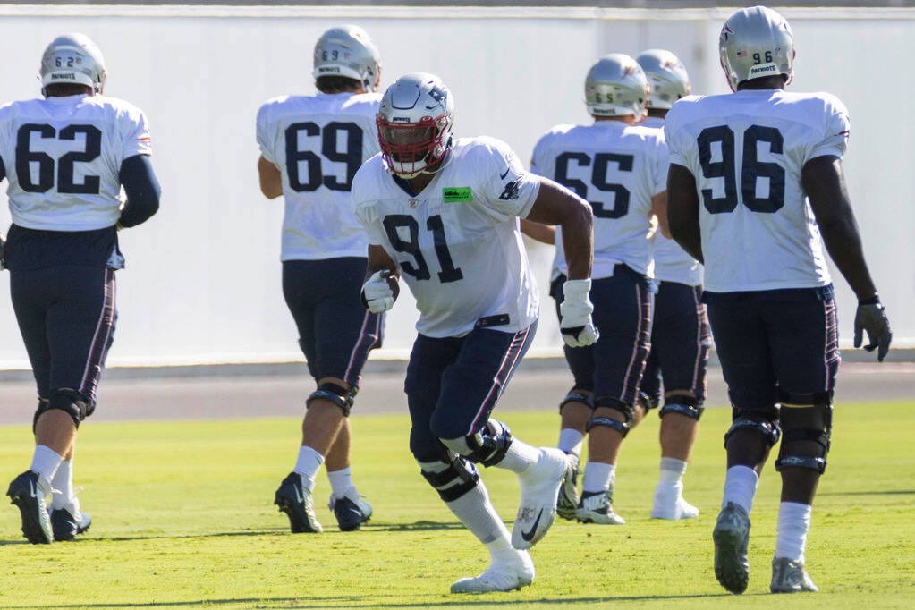 New England Patriots defensive end Deatrich Wise Jr. (91) runs during the team’s trainin ...
