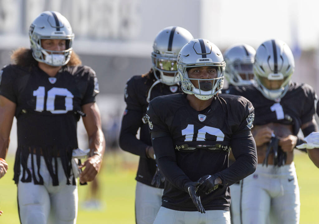 Raiders wide receiver DJ Turner (19) leads the wide receivers to drills during the team’ ...