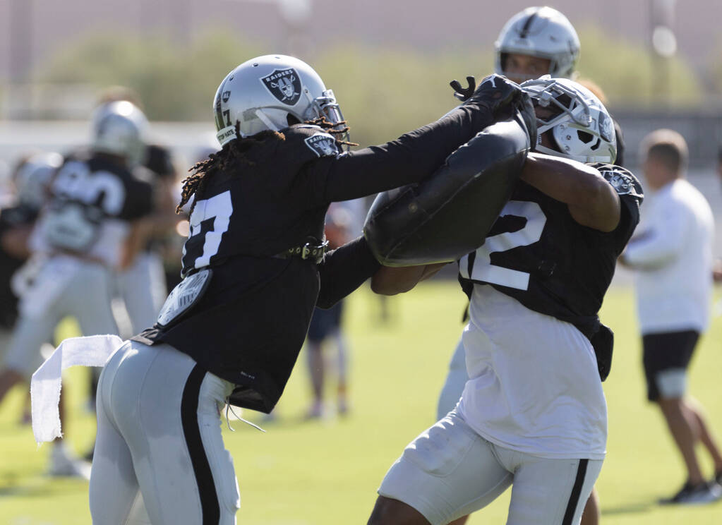 Raiders wide receiver Davante Adams (17) works against wide receiver Justin Hall (12) during th ...