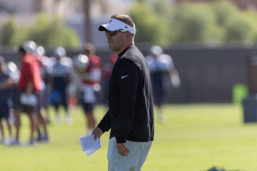 Raiders head coach Josh McDaniels looks on during the team’s training camp practice at t ...