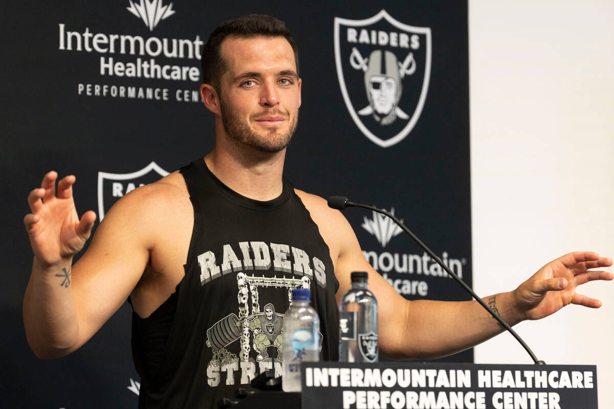 Raiders quarterback Derek Carr answers questions during a news conference after training camp p ...
