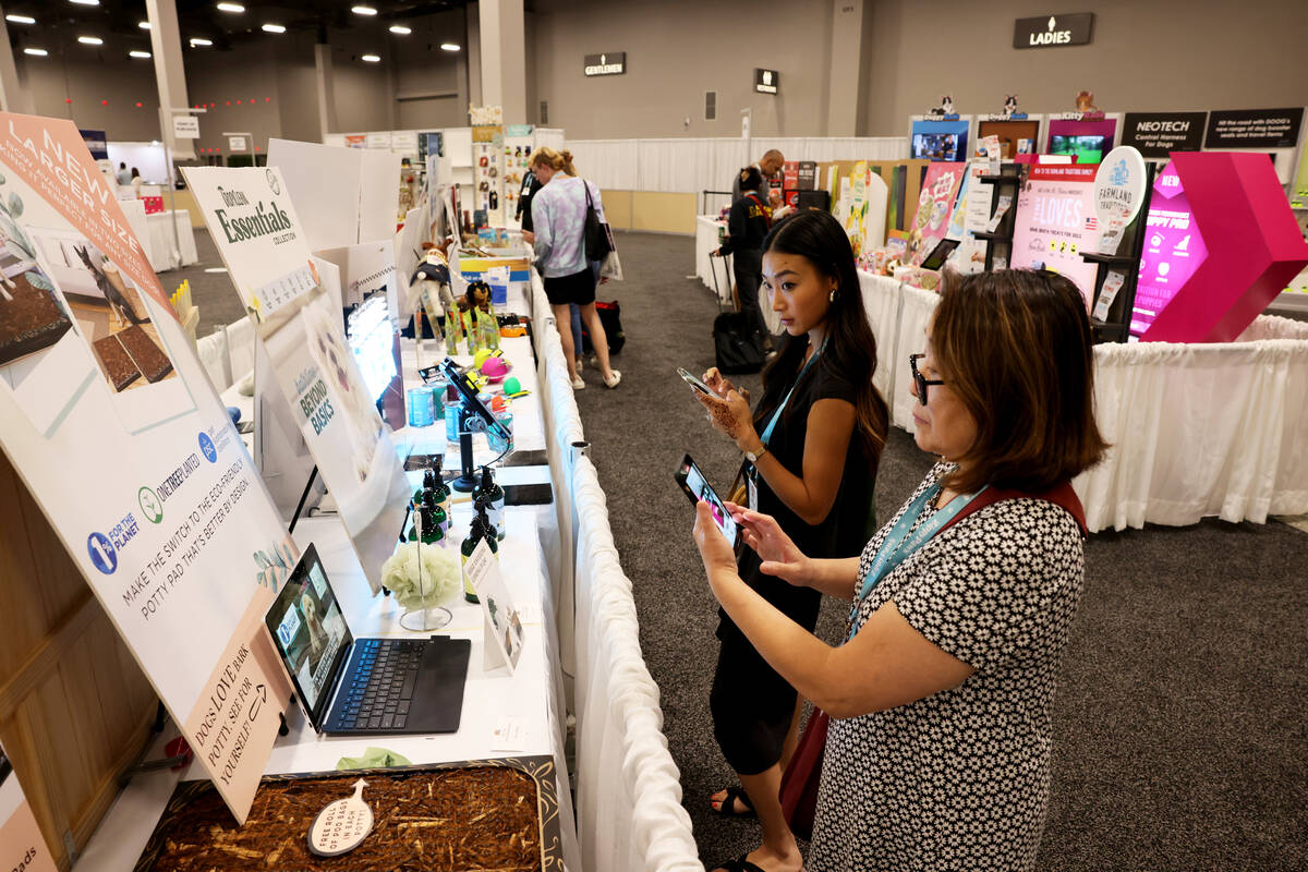 Conventioneers check out new products during the SuperZoo pet industry trade show at Mandalay B ...