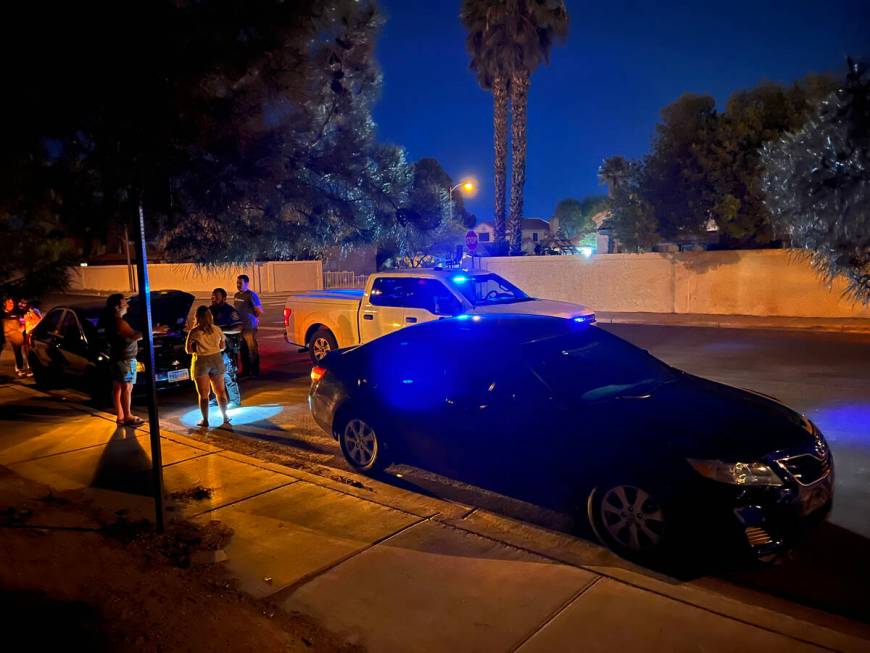 North Las Vegas Police Officer Andy Navarro investigates a crash at San Miguel Avenue and Colem ...