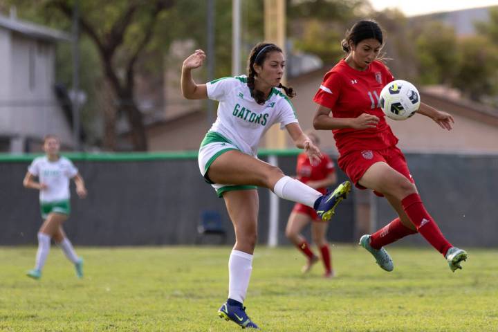 Arbor View’s Yalina Shah (11) jumps to kick while Green Valley’s Azlyn Olofson, l ...