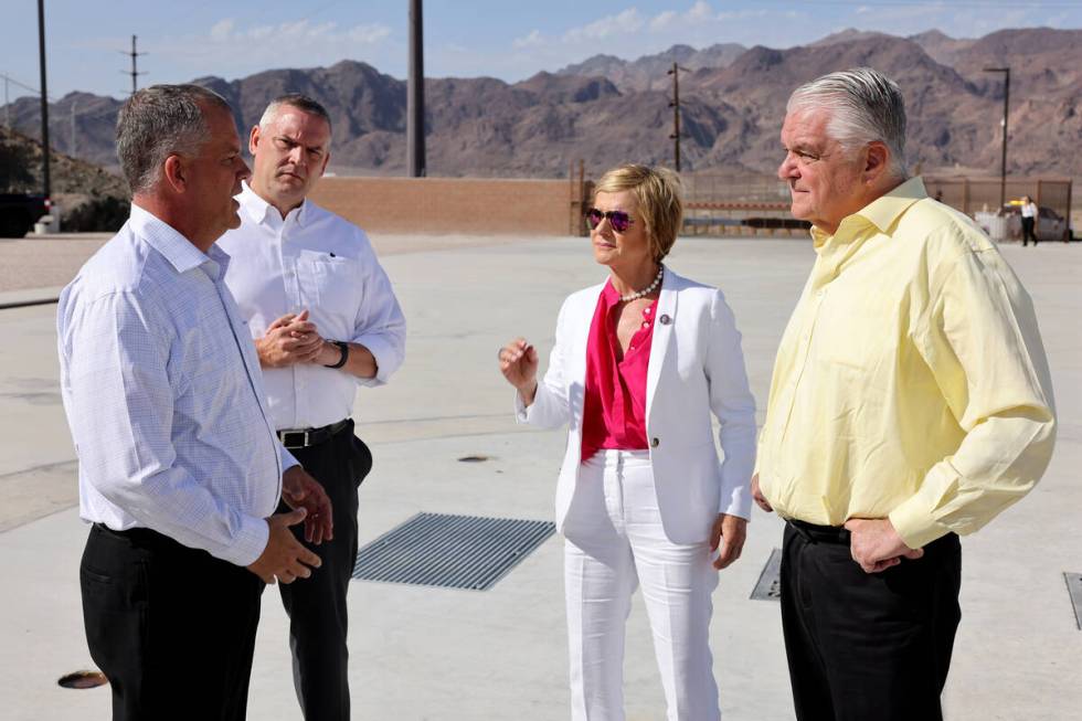 Nevada Gov. Steve Sisolak, right, tours the Southern Nevada Water Authority new low-lake-level ...