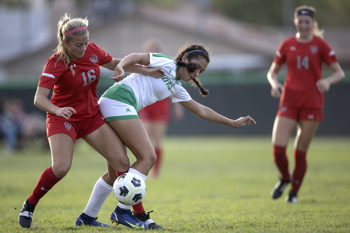 Arbor View’s Isabella Srodes (16) and Green Valley’s Ella Drakulich (11) compete ...