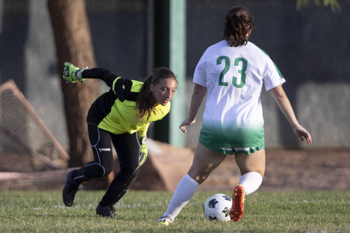 Green Valley’s goaltender saves a shot next to Brooke Onori (23) during a girls high sch ...