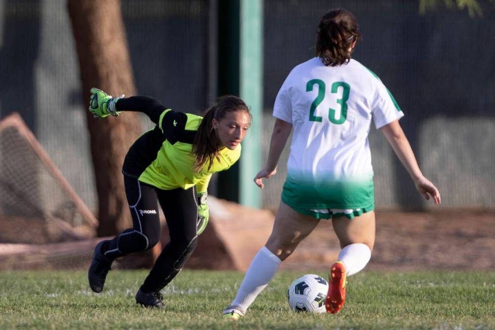 Green Valley’s goaltender saves a shot next to Brooke Onori (23) during a girls high sch ...