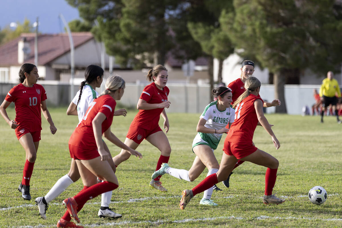 Players dribble toward the net during a girls high school soccer game between Arbor View and Gr ...