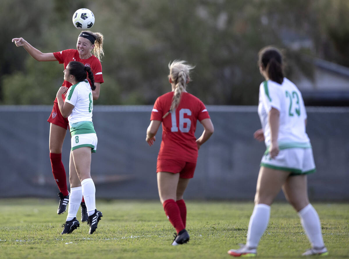 Arbor View’s Madison Little heads the ball against Green Valley’s Azlyn Olofson ( ...