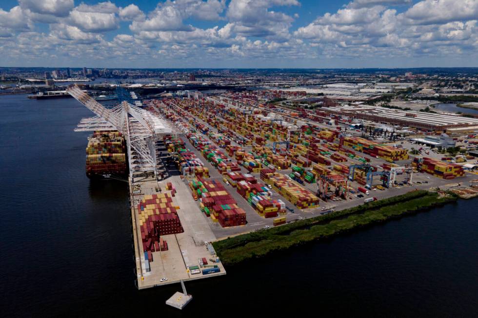 Shipping containers are stacked together at the Port of Baltimore, Friday, Aug. 12, 2022, in Ba ...