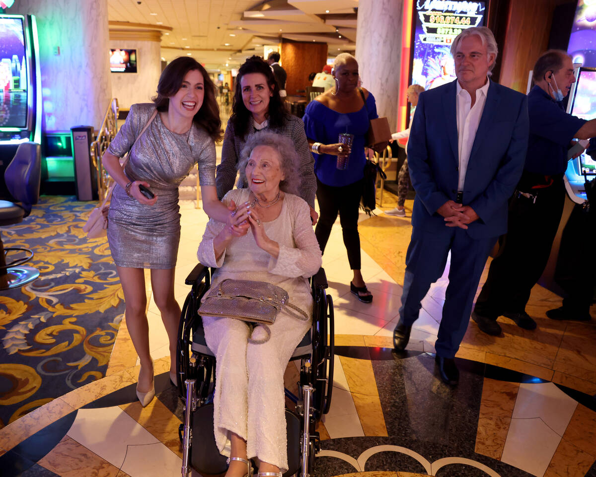 Gloria Dea, who was the first magician to perform on the Strip, reacts to the crowd as she arri ...