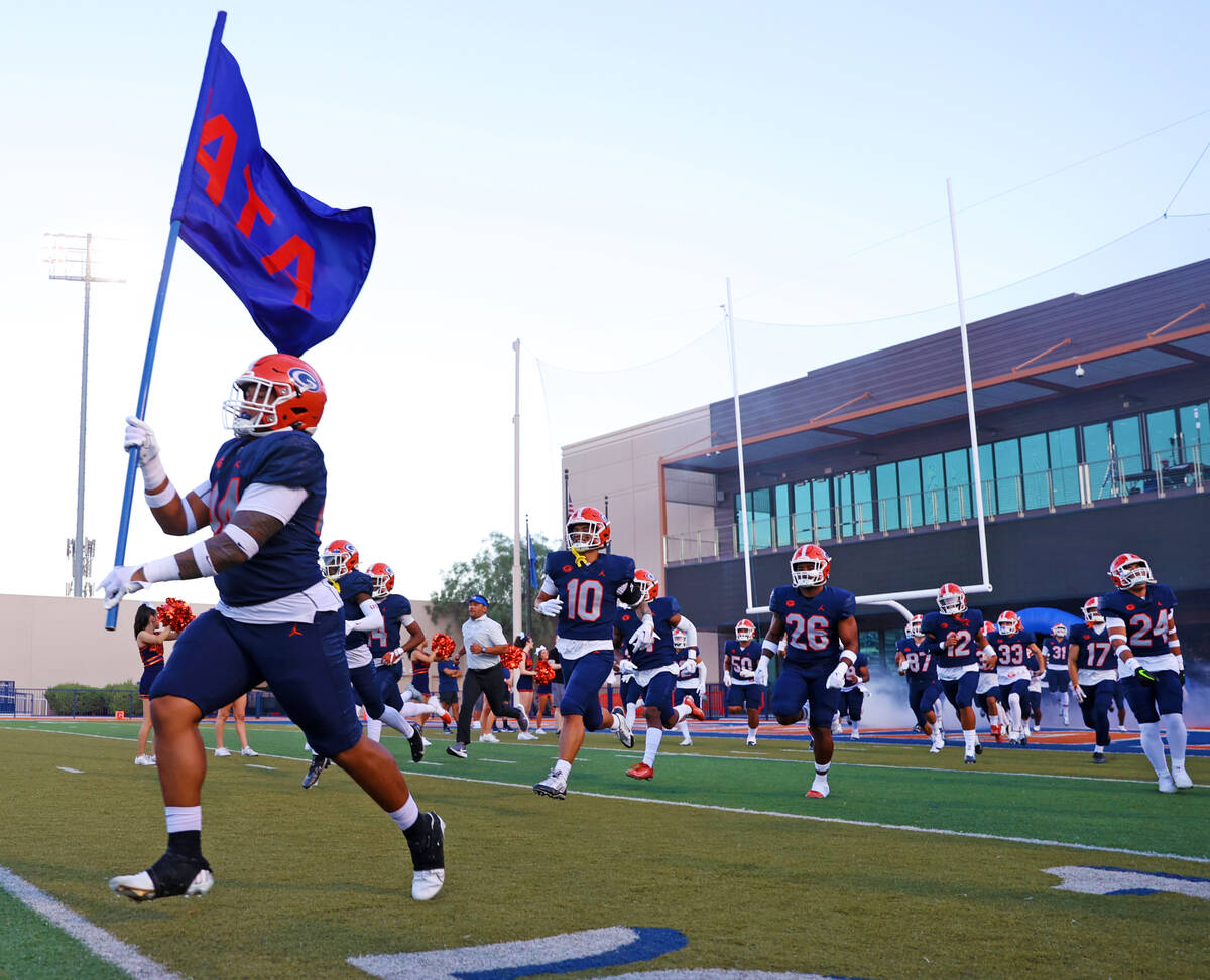 Bishop Gorman players take the field for a football game against Corner Canyon at Bishop Gorman ...