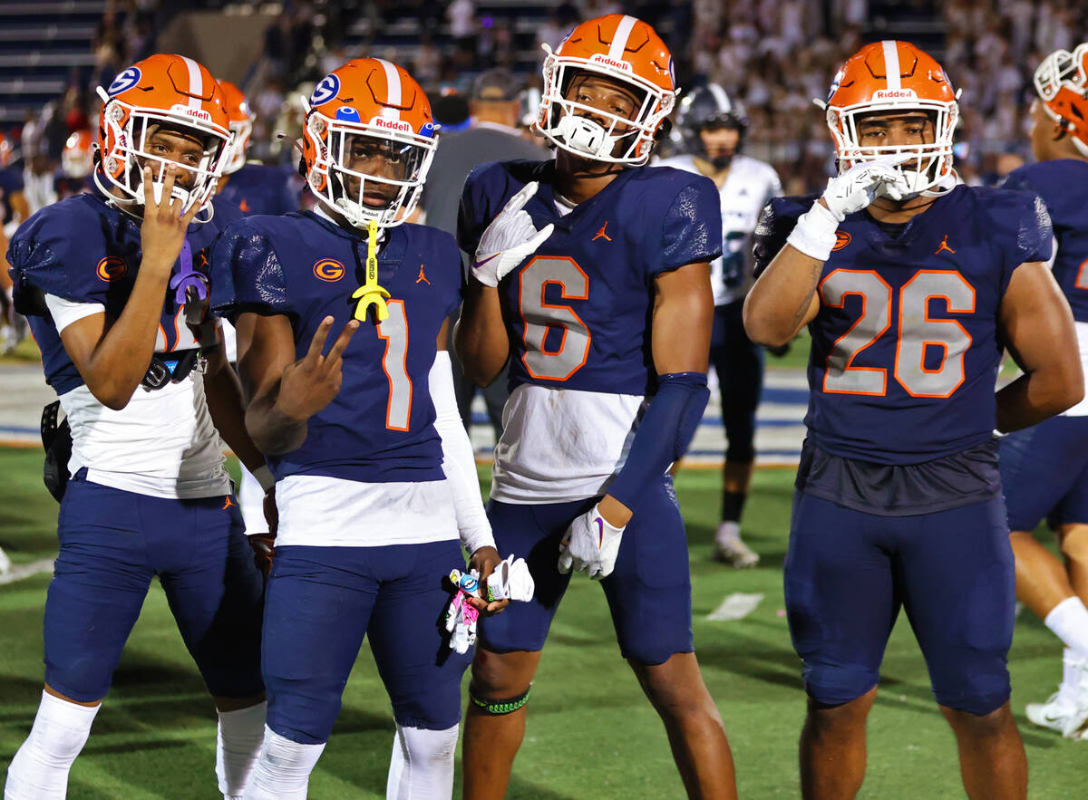 Bishop Gorman players pose following their win over Corner Canyon 42-7 during a football game a ...