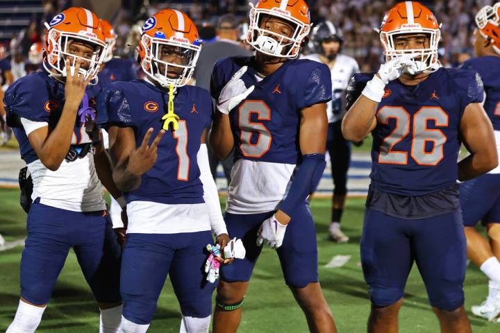 Bishop Gorman players pose following their win over Corner Canyon 42-7 during a football game a ...