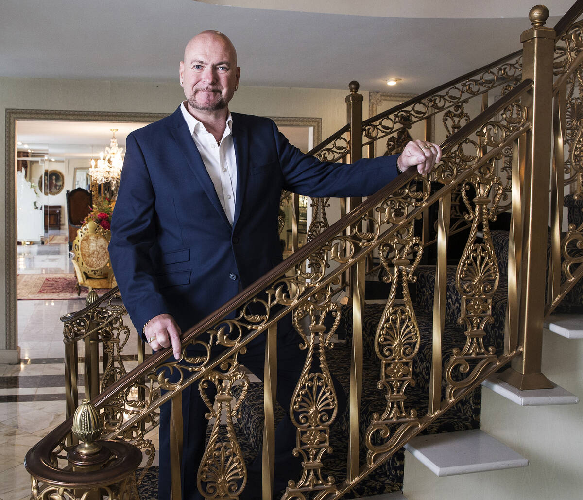 Mansion owner Martyn Ravenhill at the staircase, which was imported from Paris. (Las Vegas Revi ...